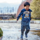 happy kid playing in the rain